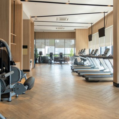 modern-fitness-center-with-gym-equipment-decoration-interior-design-background.jpg
